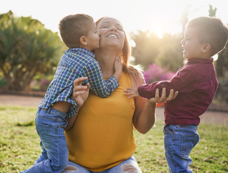 Happy Single Mother With Twin Sons In Nature Park Family Day 